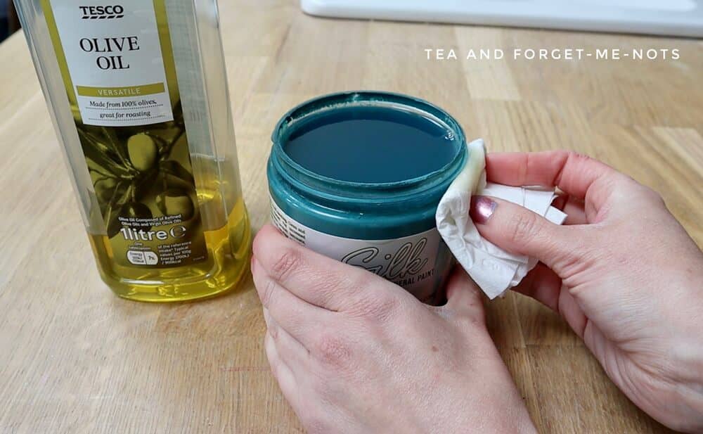 Add olive oil to stop paint lid from sticking
