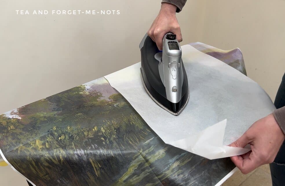 Applying decoupage paper with iron on method