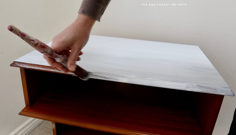 Applying slick stick to the tv cabinet