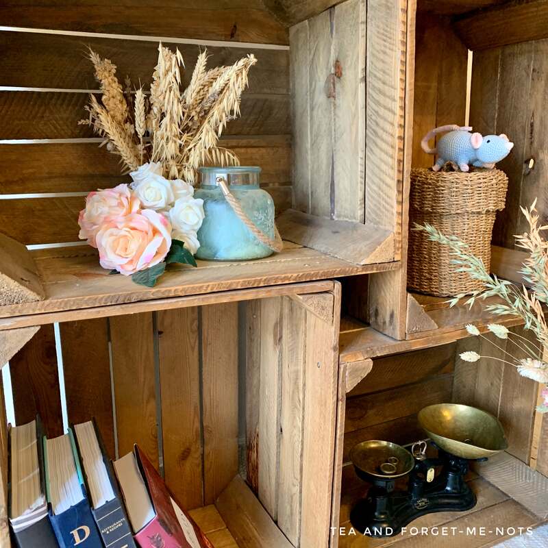 Close-up of crates as bookshelf with storage