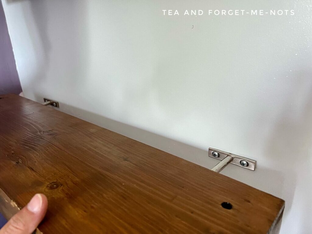 Fitting floating shelves onto bracket 