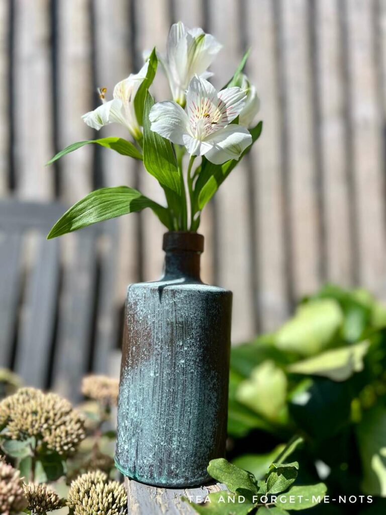 Mister bottle on faux patina paint bottle