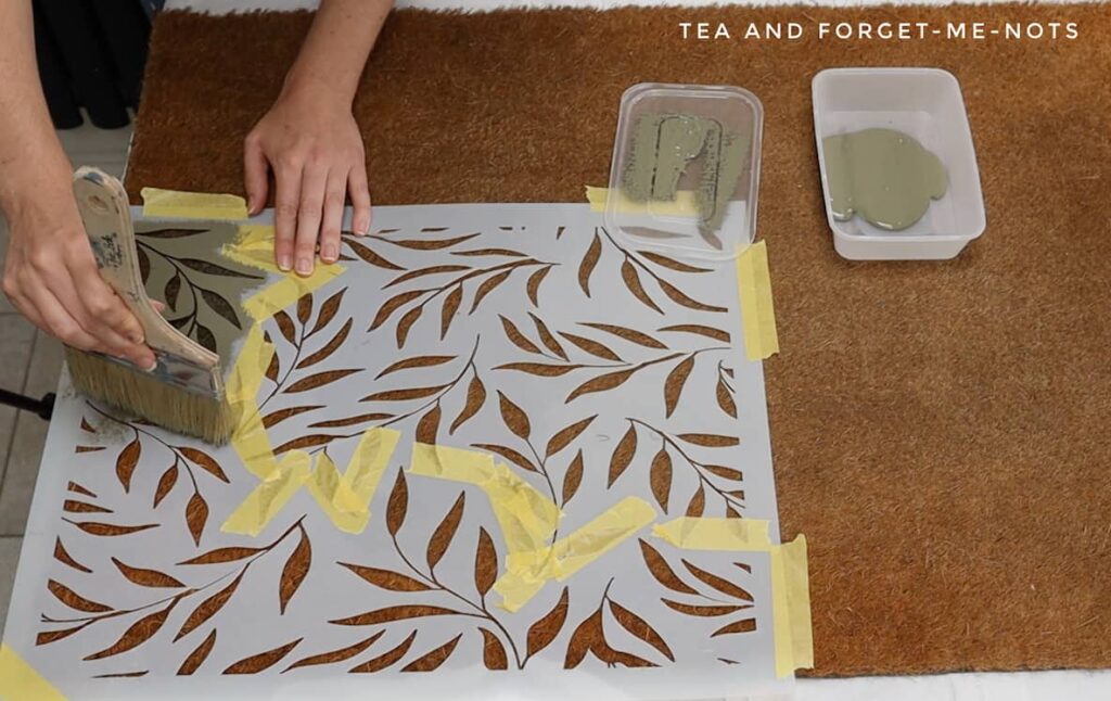 Painting diy front door mat with leaf stencil