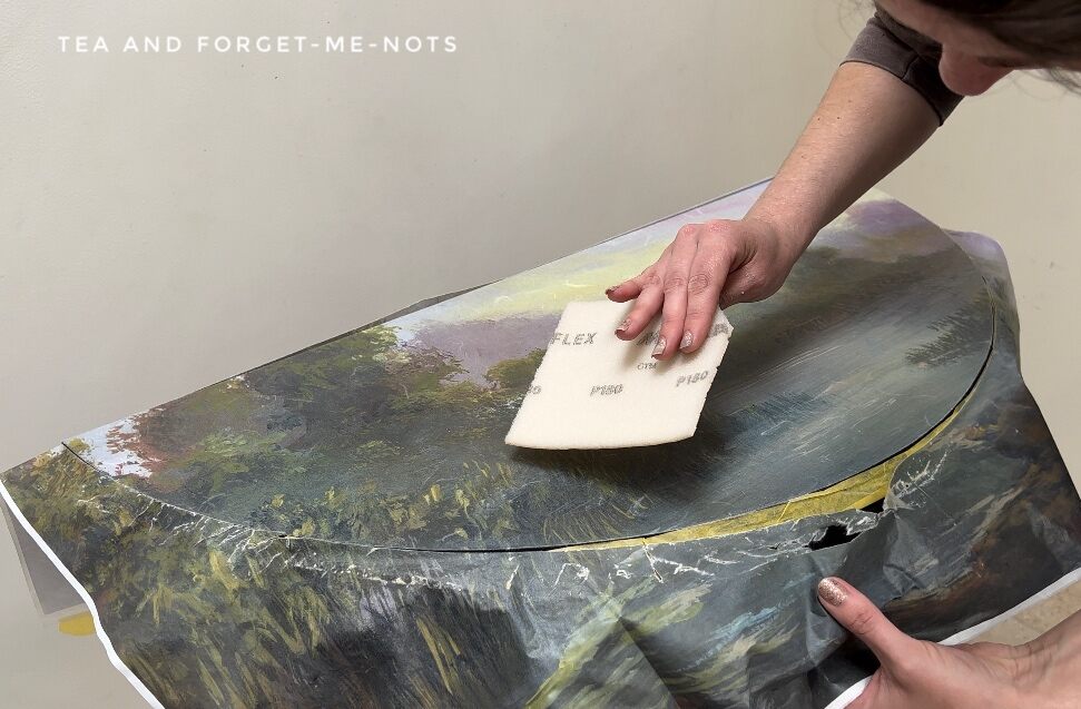 Removing edge of decoupage paper with sandpaper