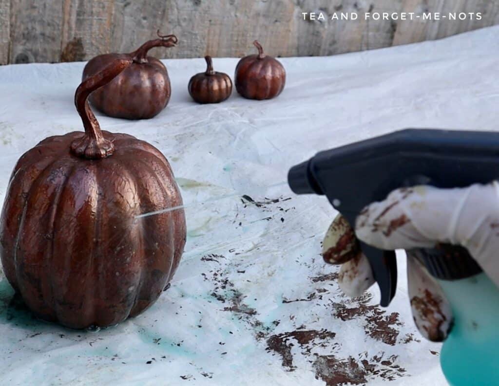 Using patina spray on metallic pumpkin