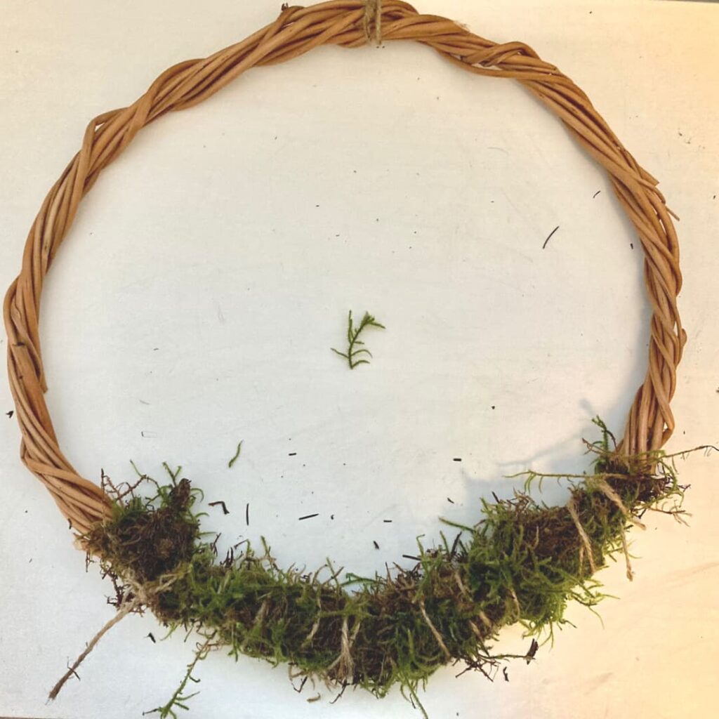 add moss to wreath base