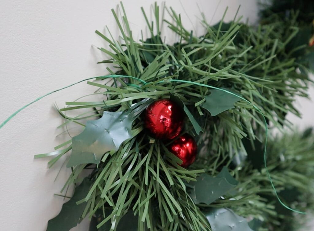 attach tinsel to wall with string