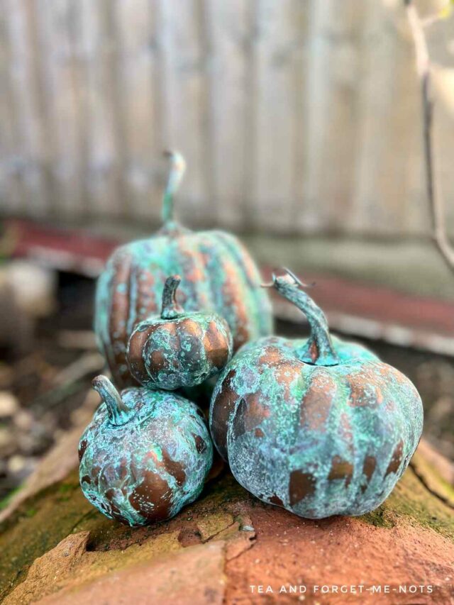 Pumpkins decorated with patina paint