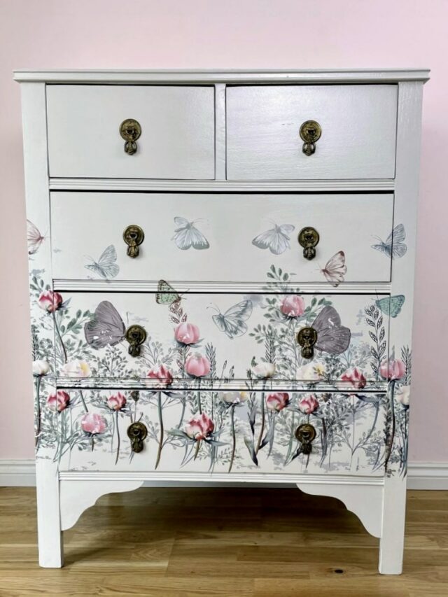 image shows cream floral chest of drawers.