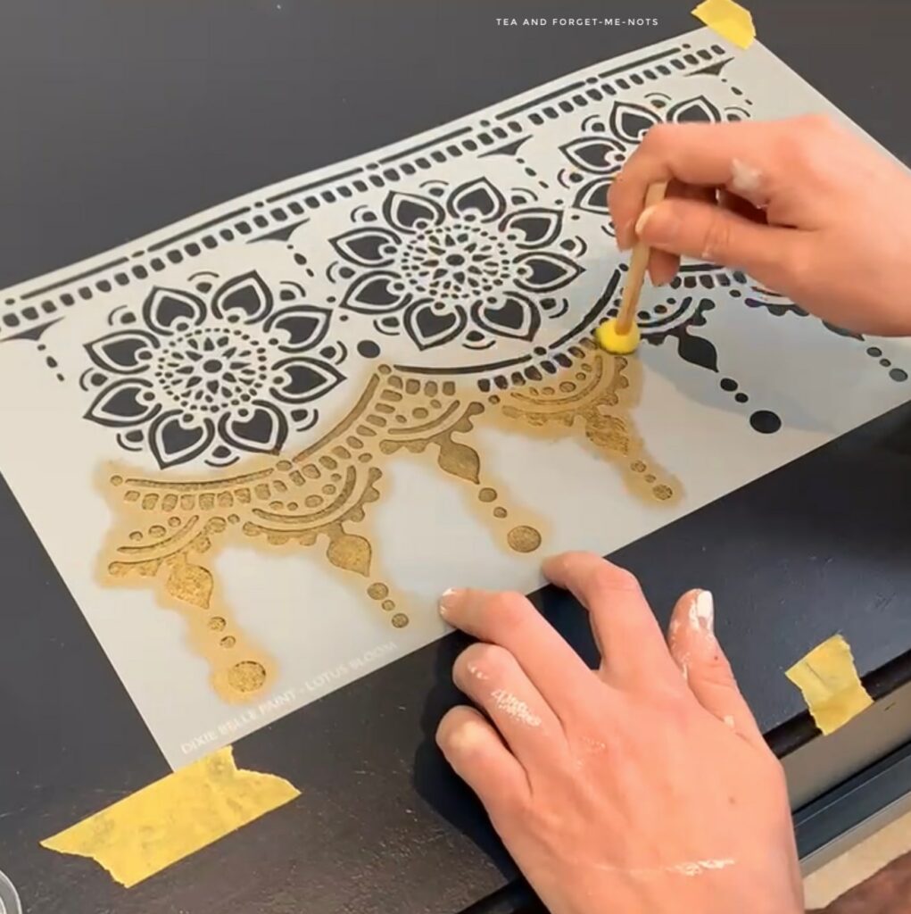 adding gold lotus bloom stencil to mdf chest.