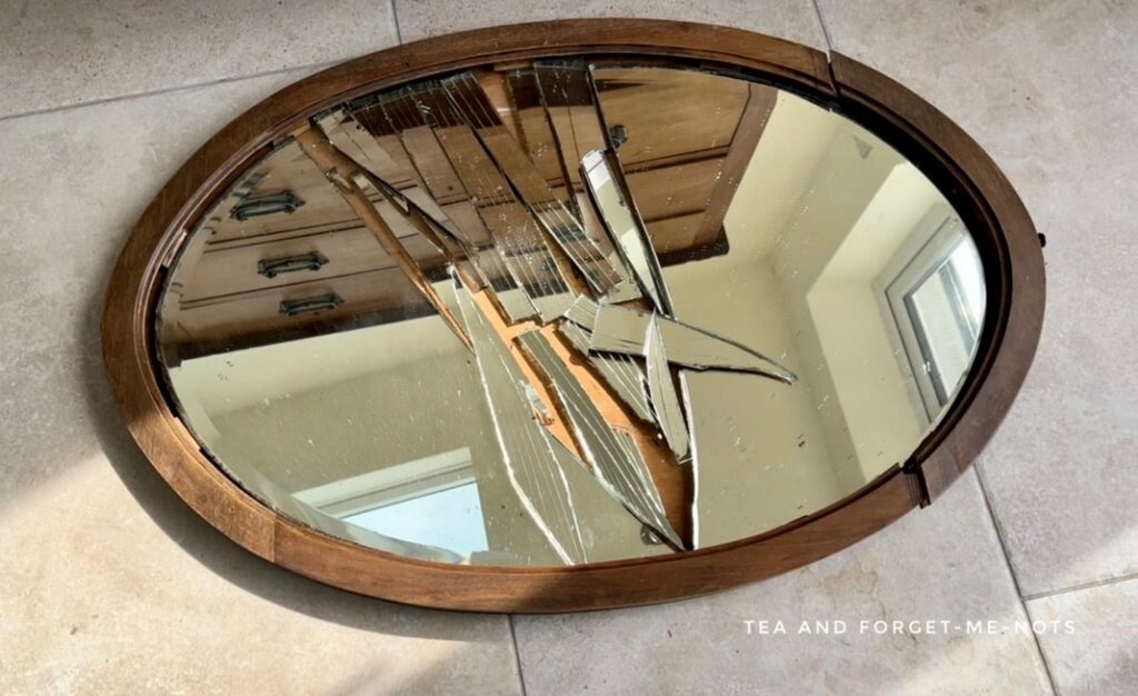 broken mirror on floor.