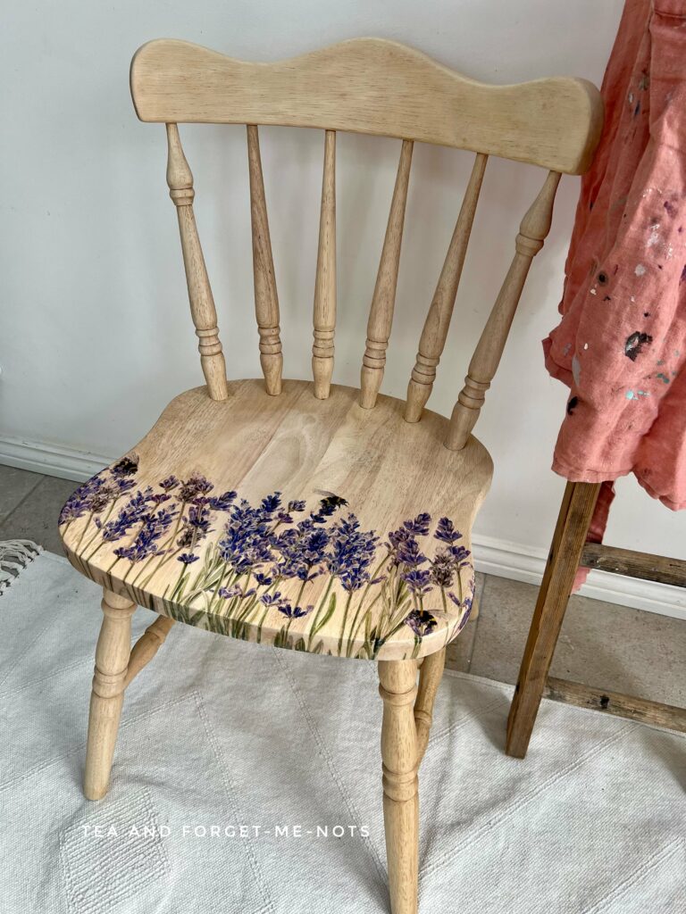 image shows wooden chair on rug.