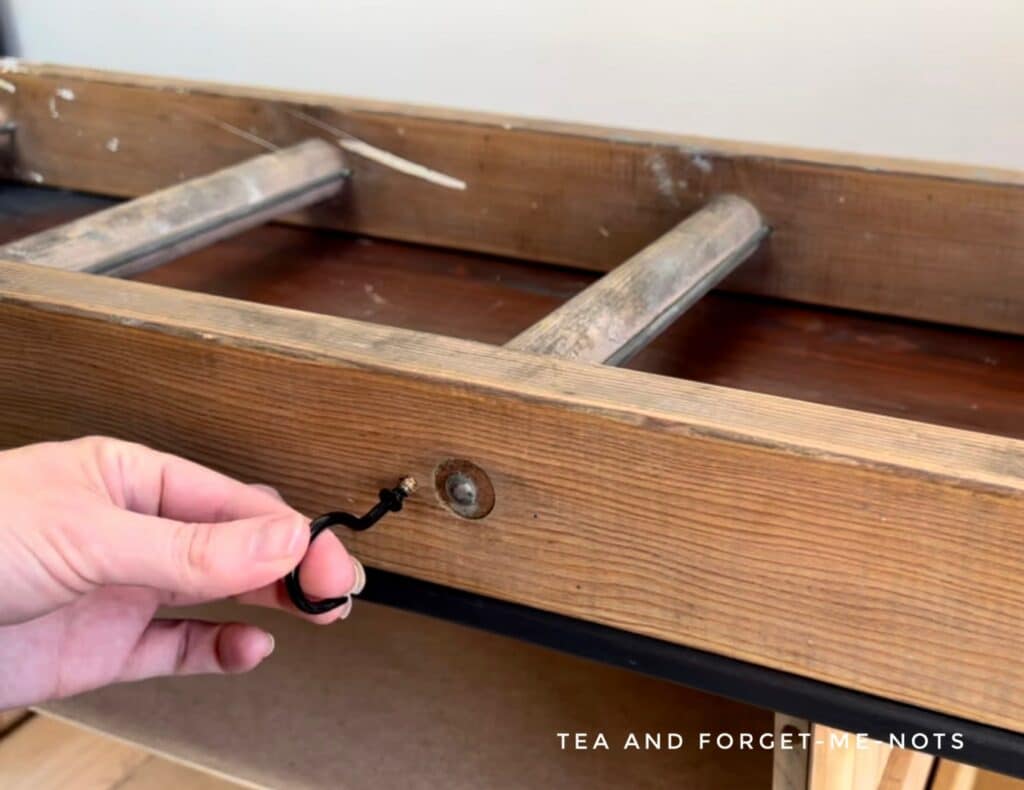 Adding coat hooks to ladder coat rack