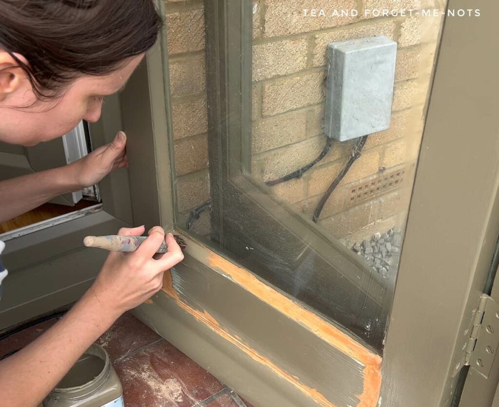 Painting over wood filler on exterior porch door