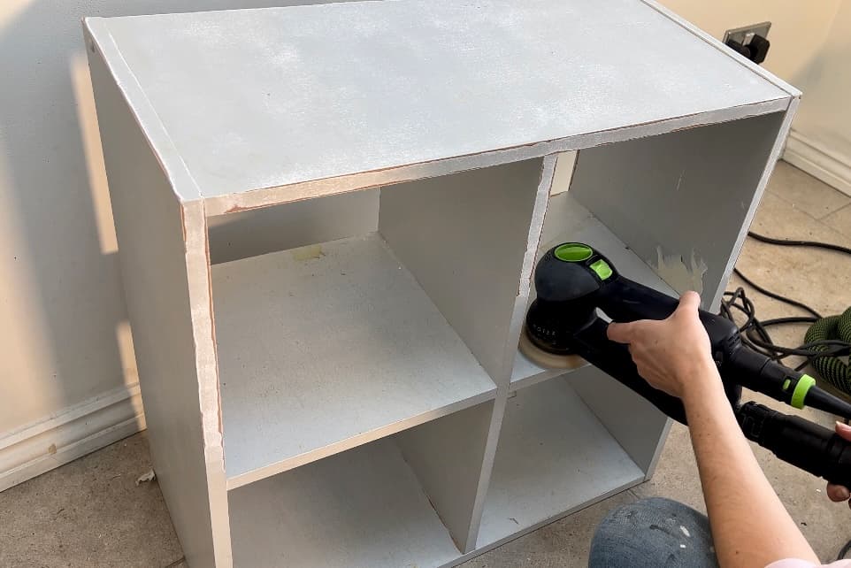 sand painted bookshelf