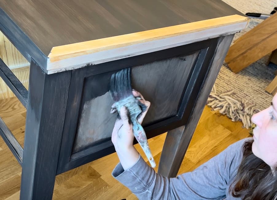 image shows applying Coffee Bean paint to side of office desk.