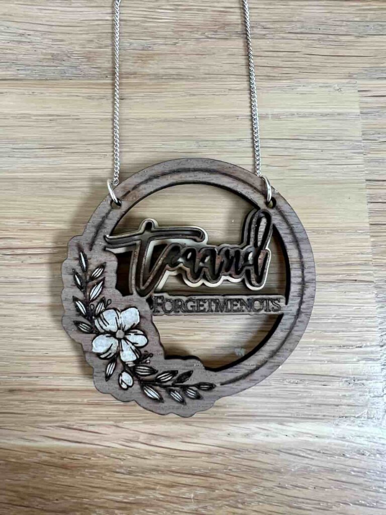 close up of laser cut necklace using m1 machine.