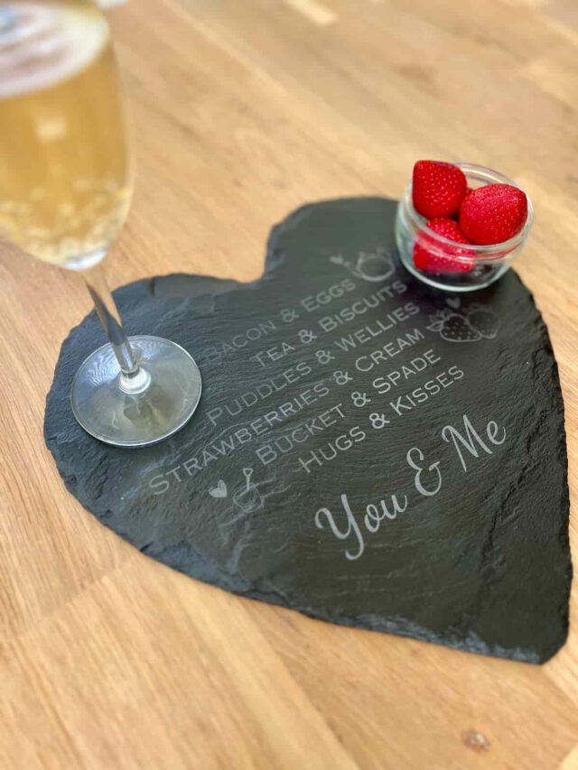 valentines gift engraved slate with drink and strawberries on top.