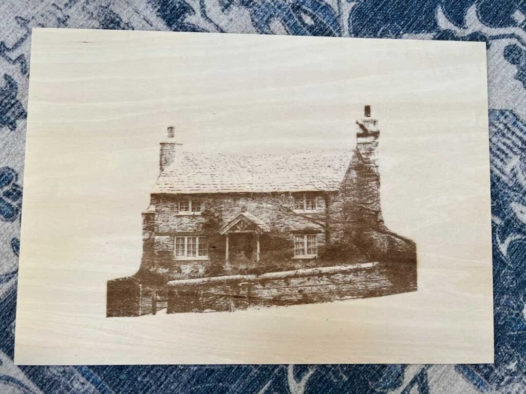 engraved cottage on basswood plywood.