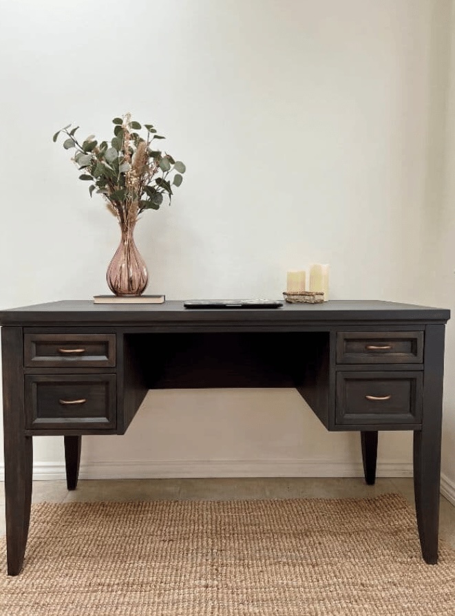 overview of painted office desk with rug.