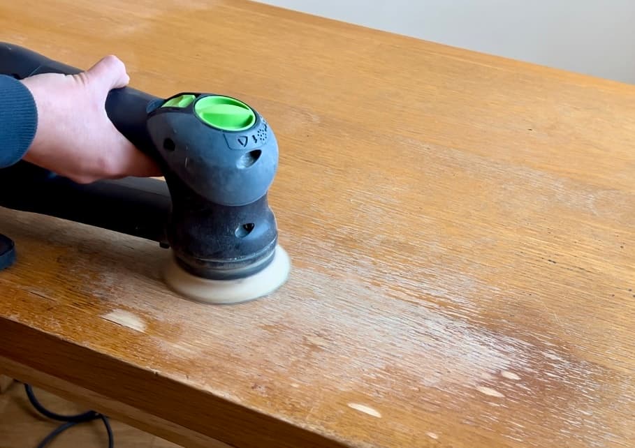 image shows sanding the top of the vintage desk.