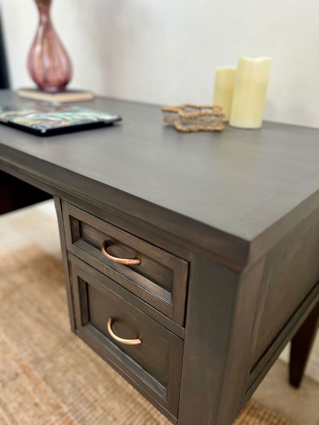 close up of drawers on office desk with objects on the top.