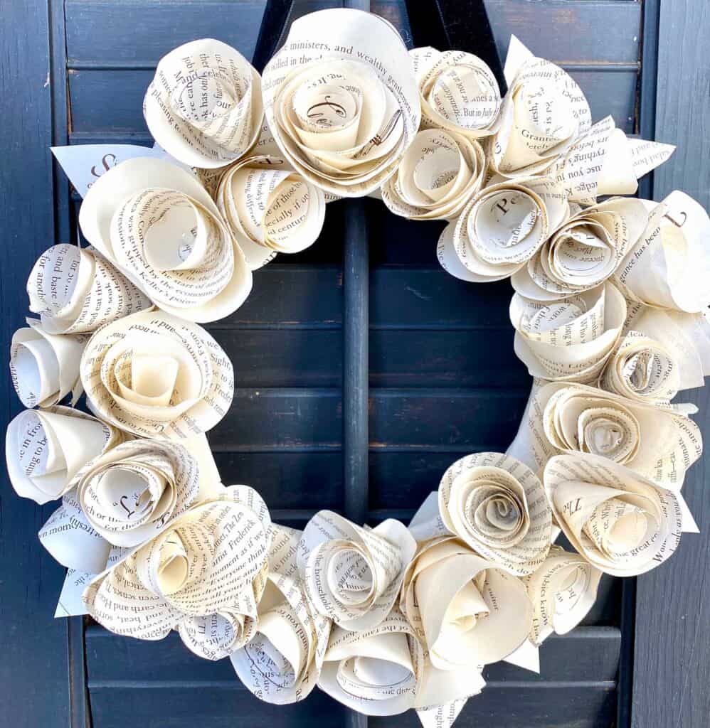 image shows wreath made from book pages.