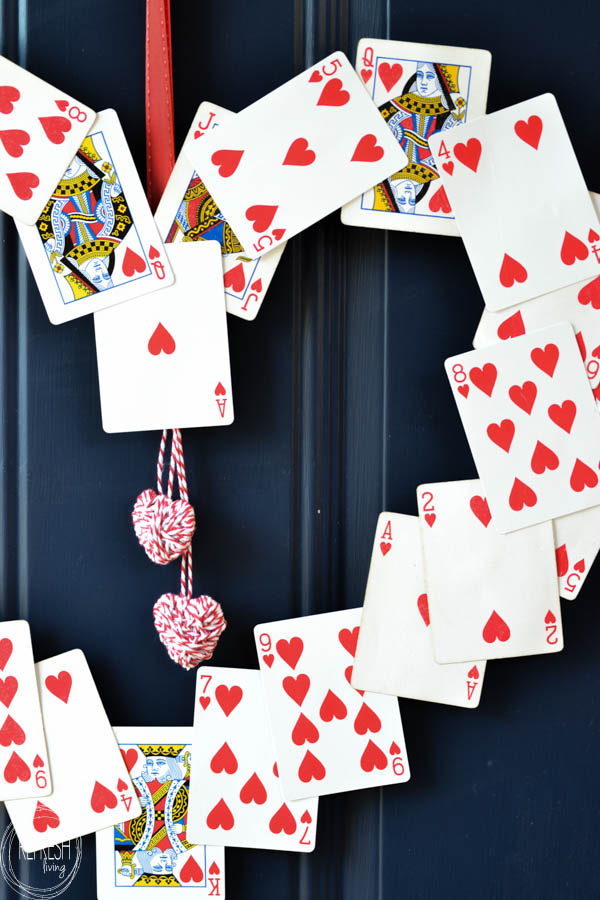 image shows heart wreath made up of playing cards.