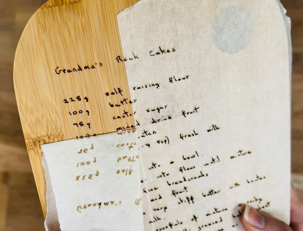 image shows peeling off tape from engraved chopping board.