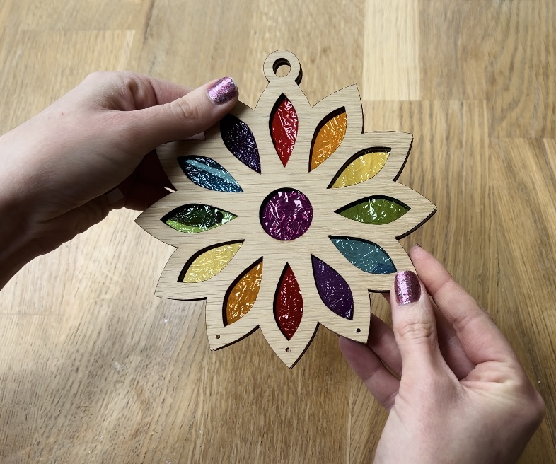 image shows suncatcher with rainbow coloured wrappers in place.