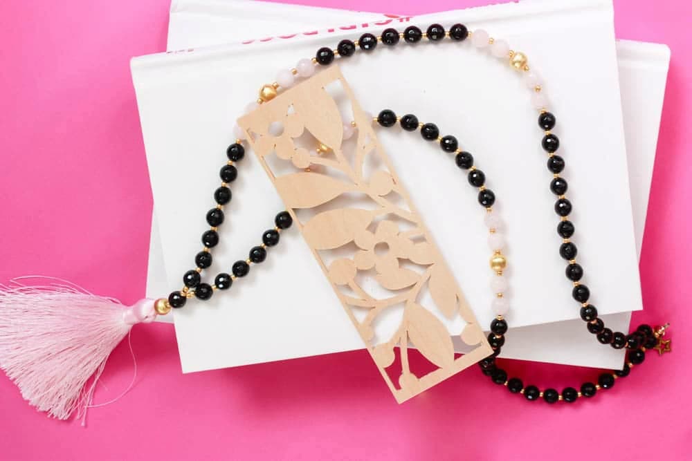image shows wooden bookmark with beads.