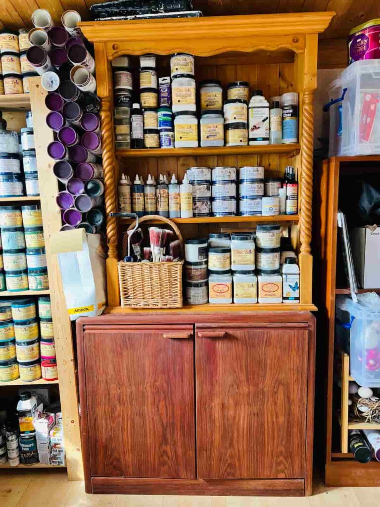 image shows paint preparation supplies organised on shelves.