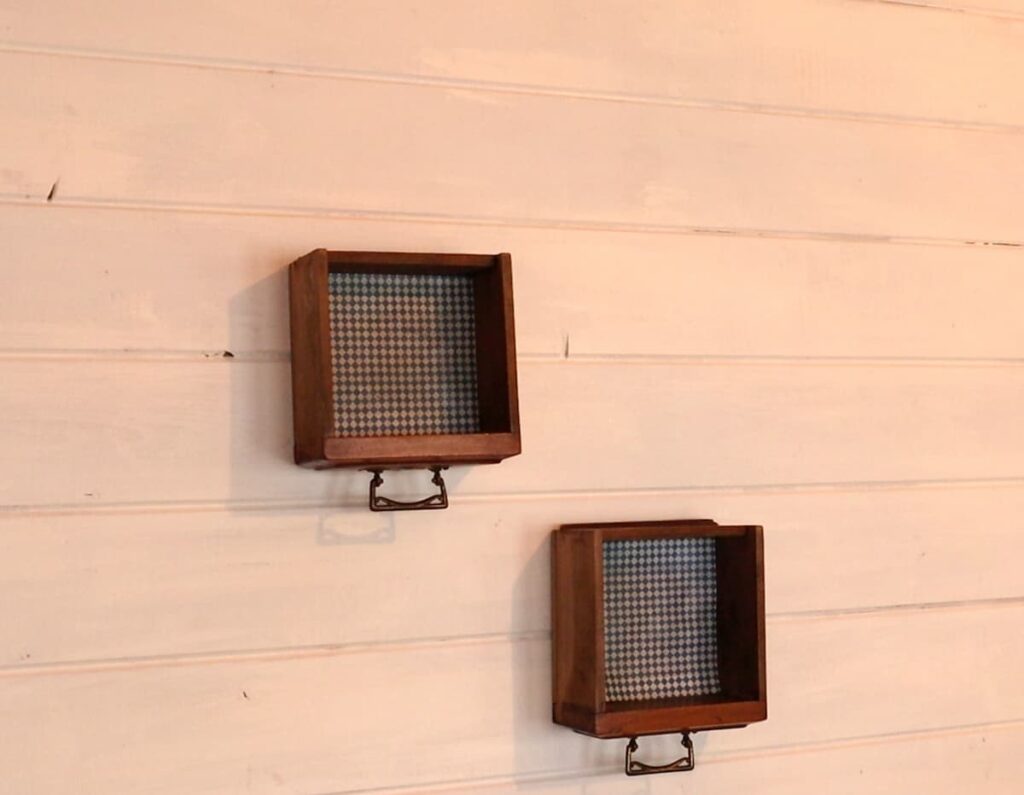 image shows two drawers repurposed as shelf storage.