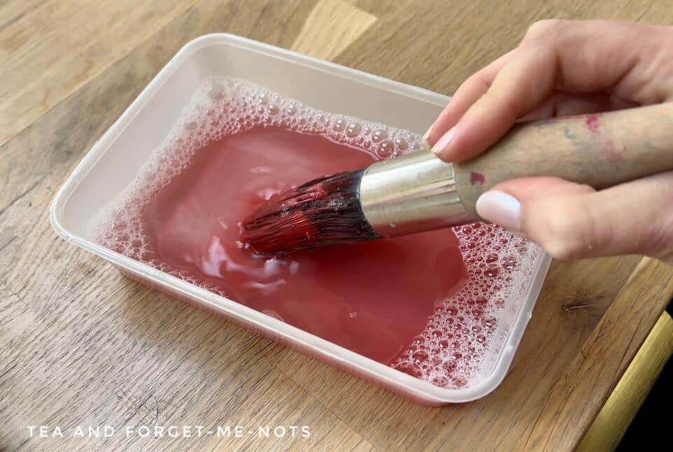 Cleaning paintbrush with dish soap