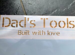 Stencil placed on wood before painting