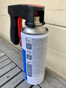 The spray paint handle on the spray can nozzle 