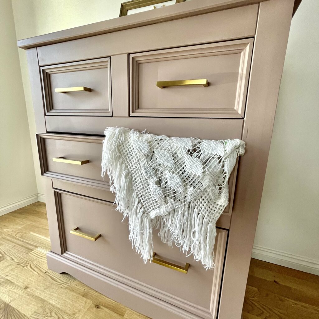 Side view of the finished pink chest of drawers 