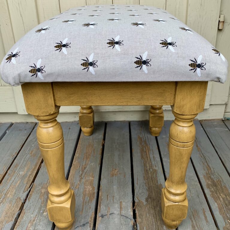 Black wax adding impact to a footstool