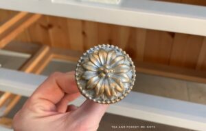 The silvery gold handle