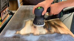Sanding the top of the drawers 