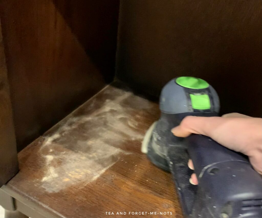 Sanding the cabinet 