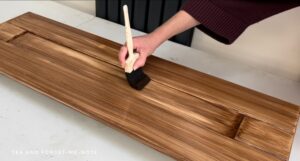 Applying the stain with a foam brush