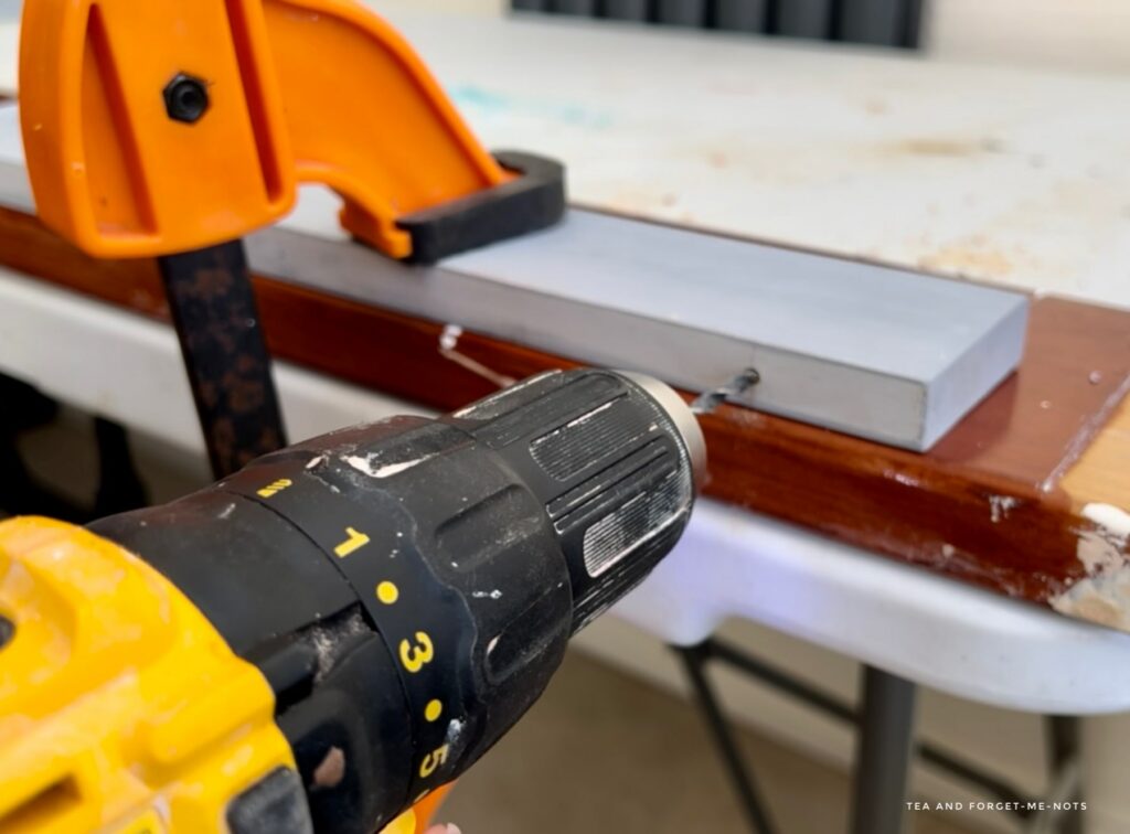 Drilling the holes to attach the pieces of wood 