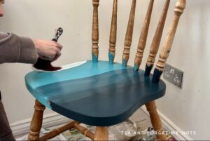 Adding clay paint to the chair seat