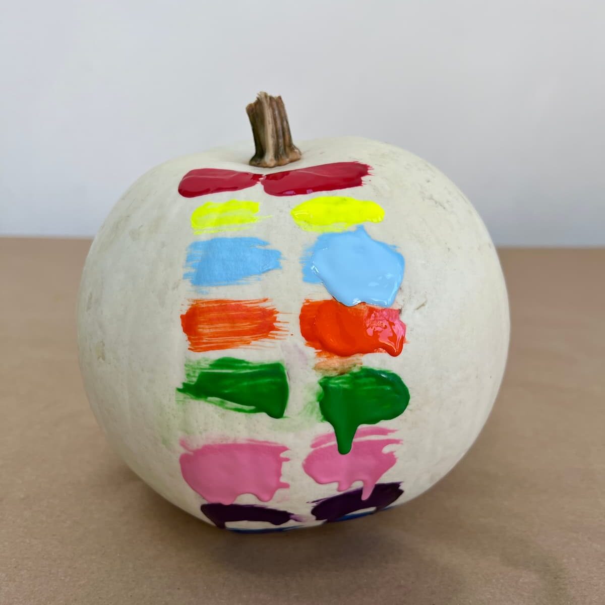 kids paint on pumpkins