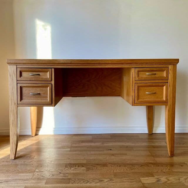 light brown office desk on wooden floor.