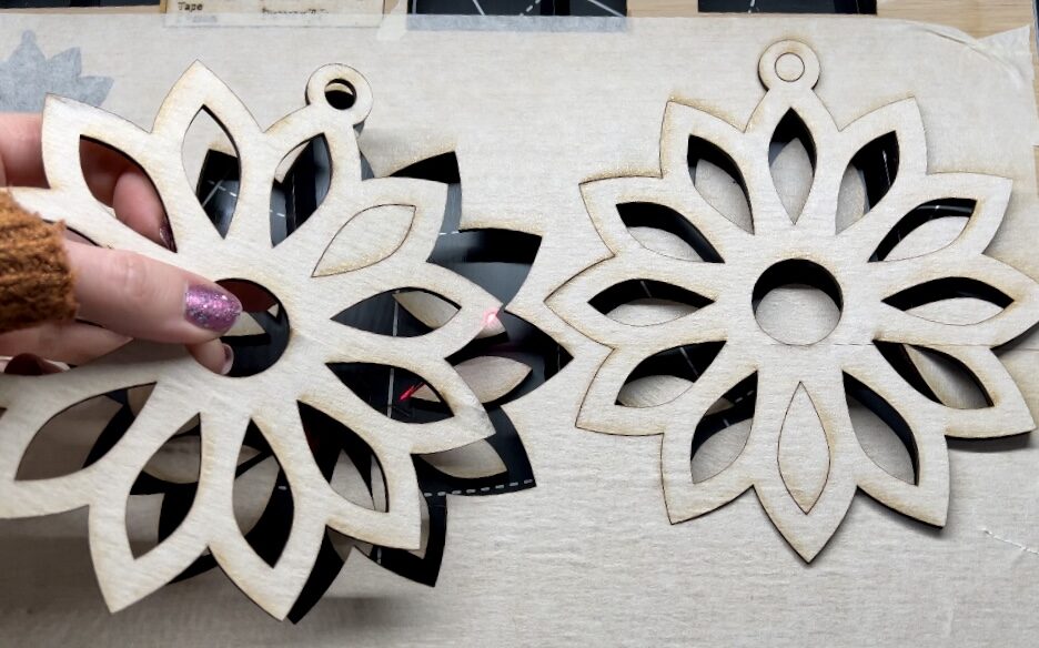 image shows cutting out flowers on laser cut plywood.