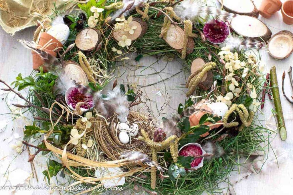 image shows wreath with birds nest.
