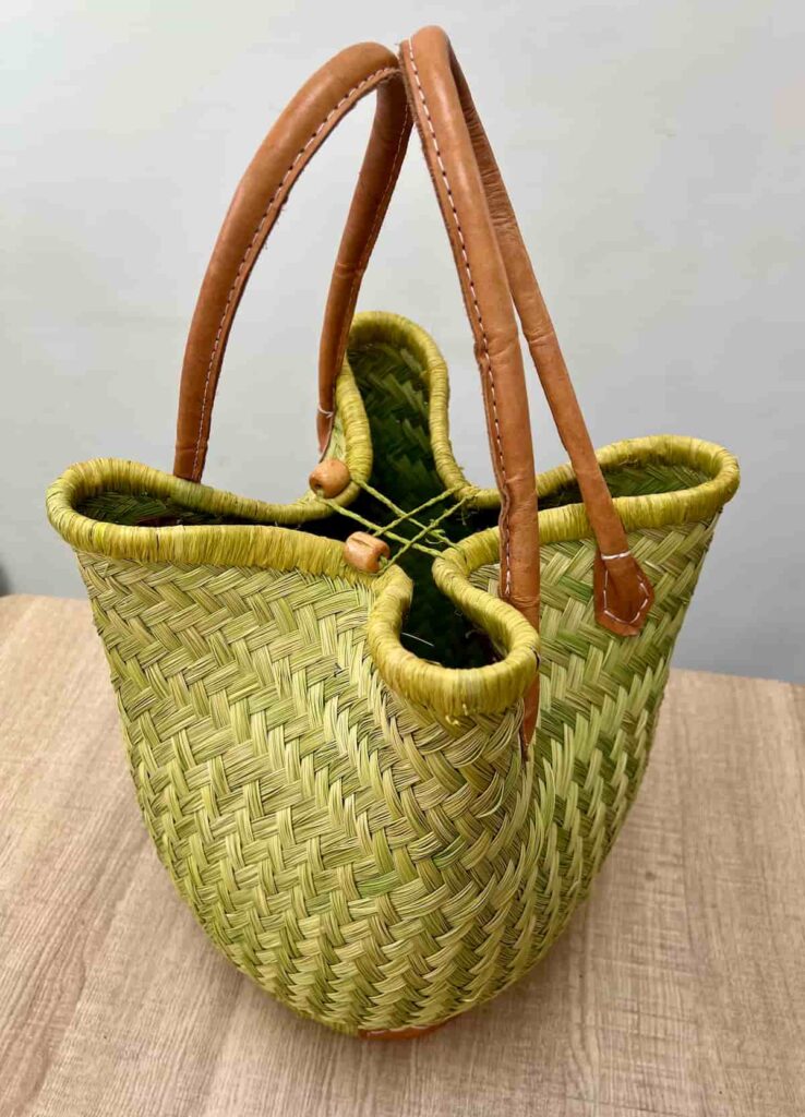image shows green basket bag before makeover.