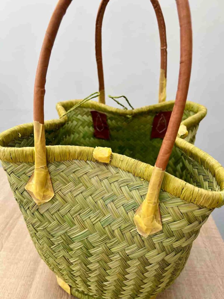 image shows handles of basket protected with painters tape.